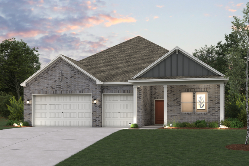 A house with garages and a lawn.