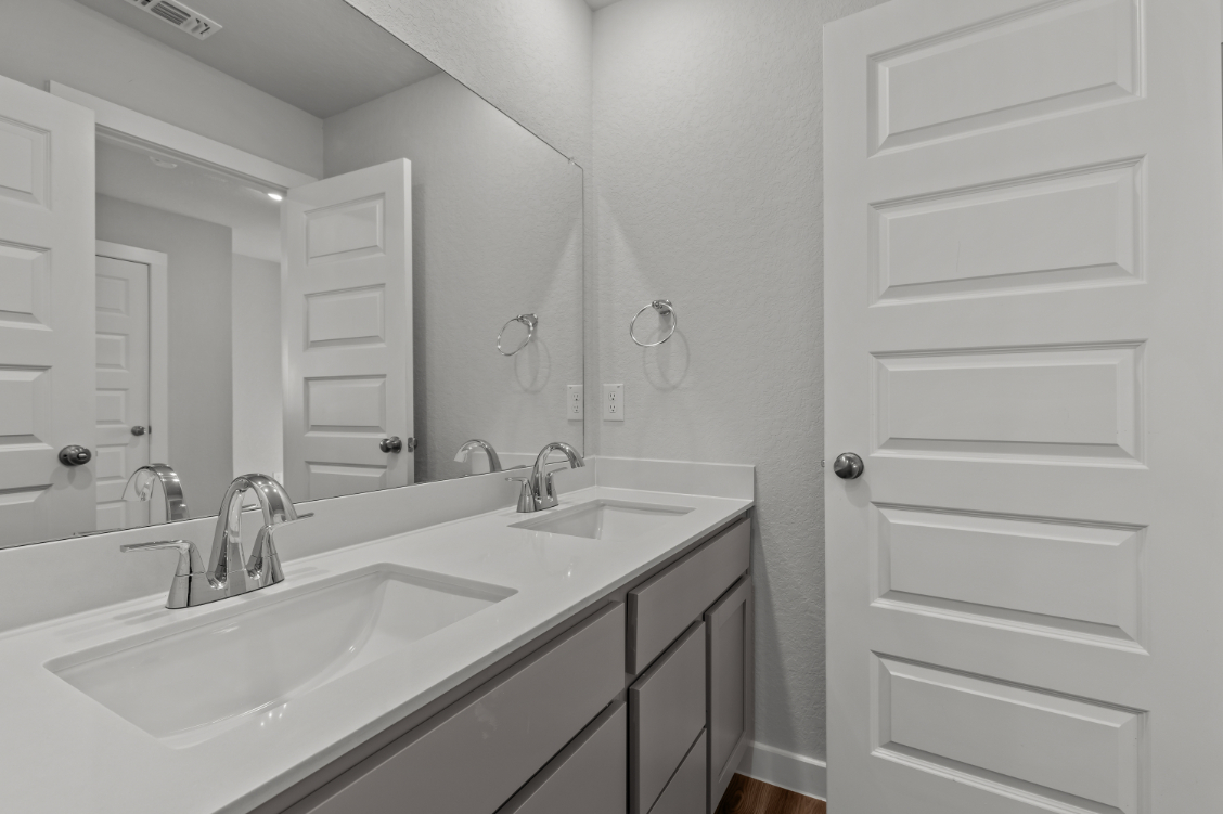 A bathroom with two sinks.