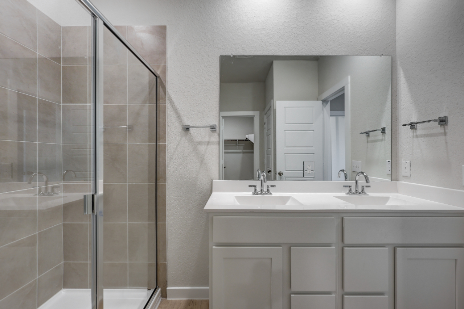 A bathroom with a glass shower.
