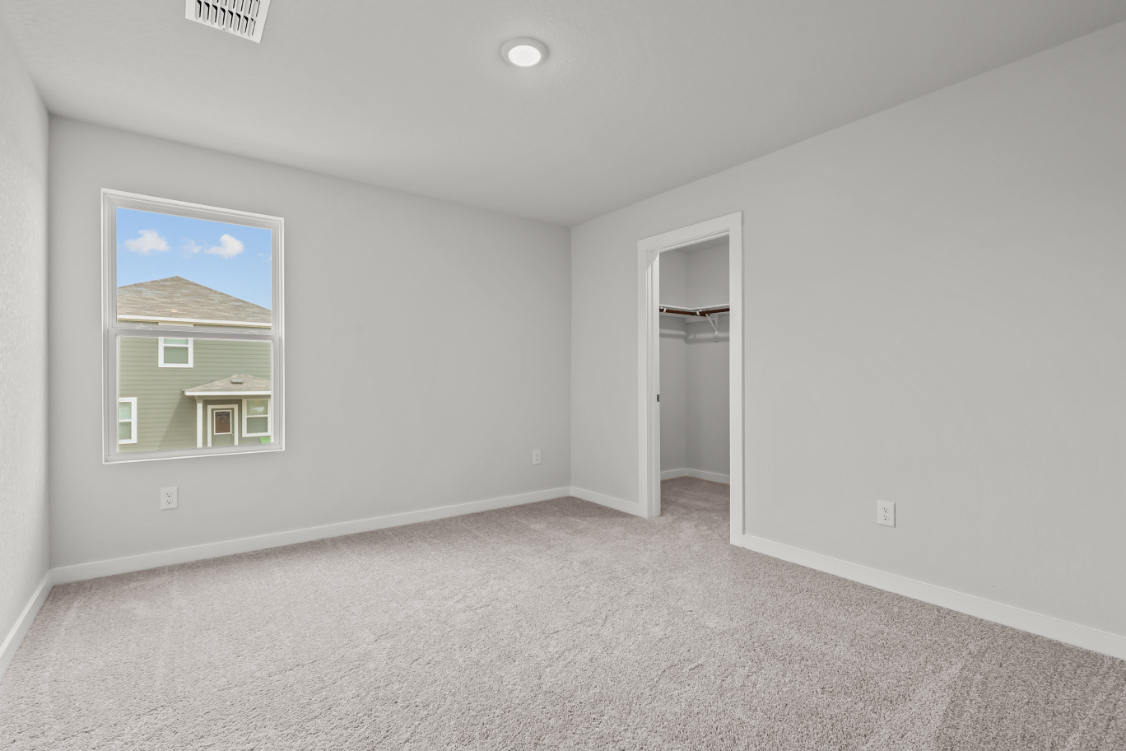A room with a door and a window.