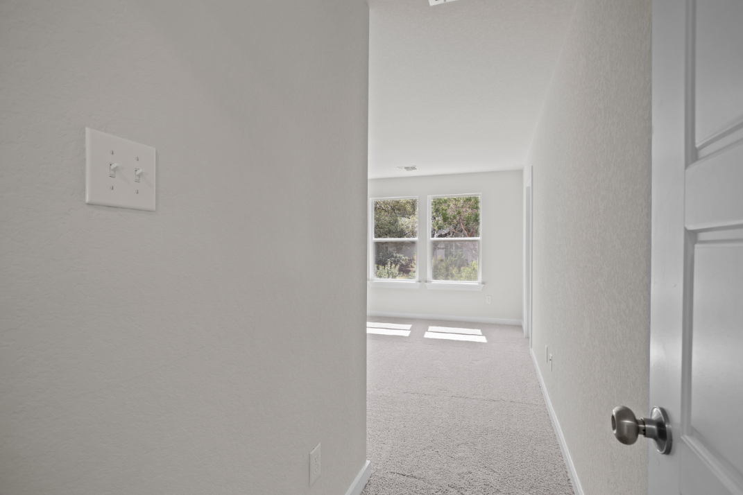 A hallway with a window.