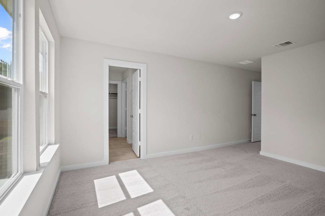 A hallway with white walls.