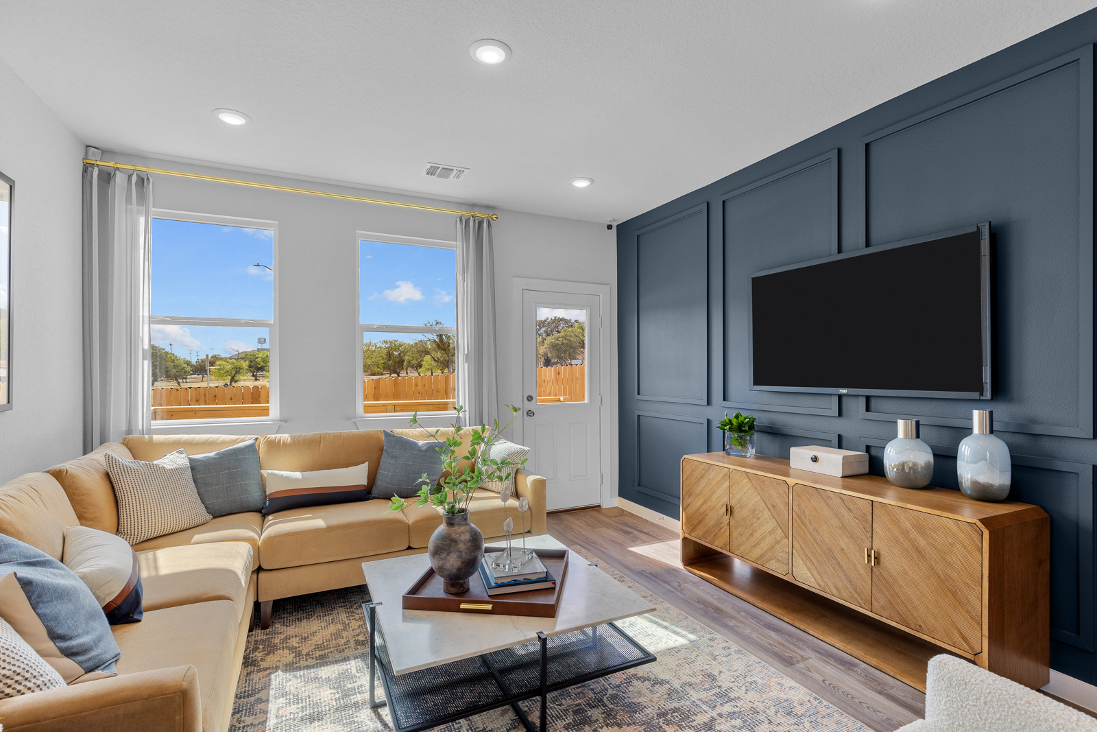 A living room with a tv and couches.