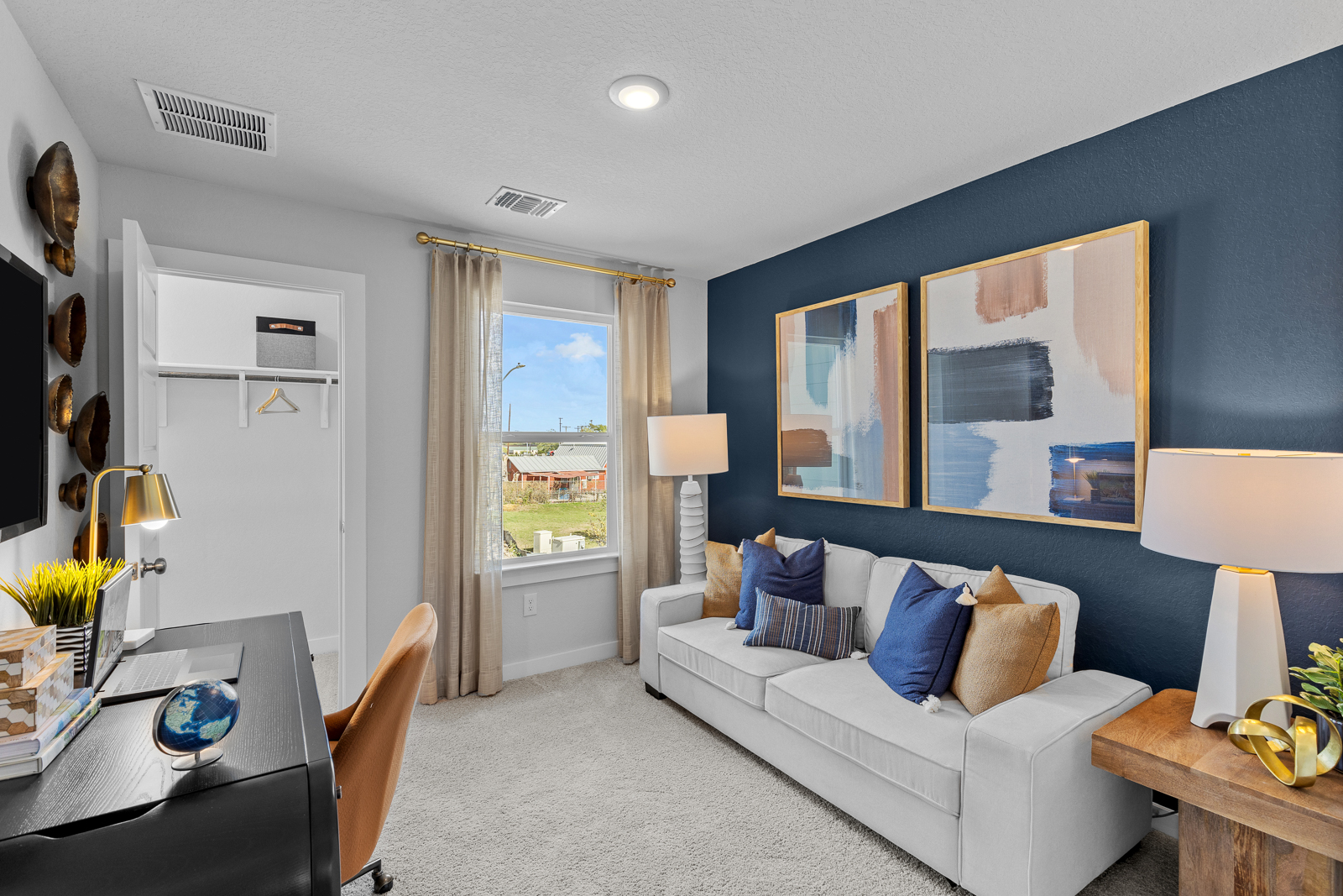 A living room with a couch and a table.