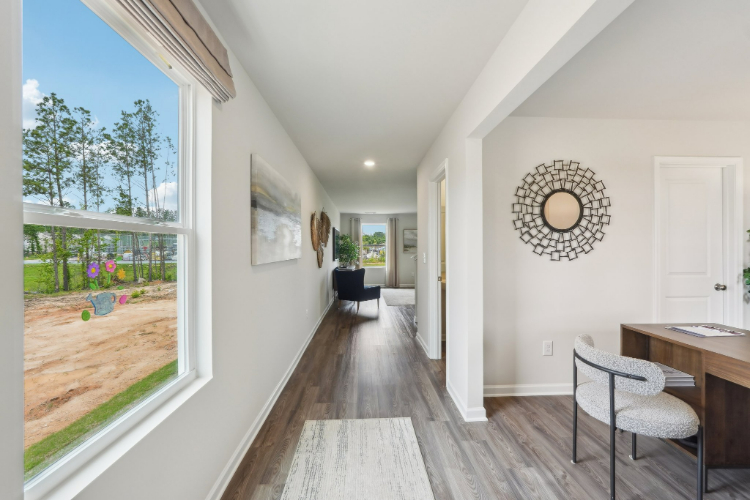 A room with a table and chairs.