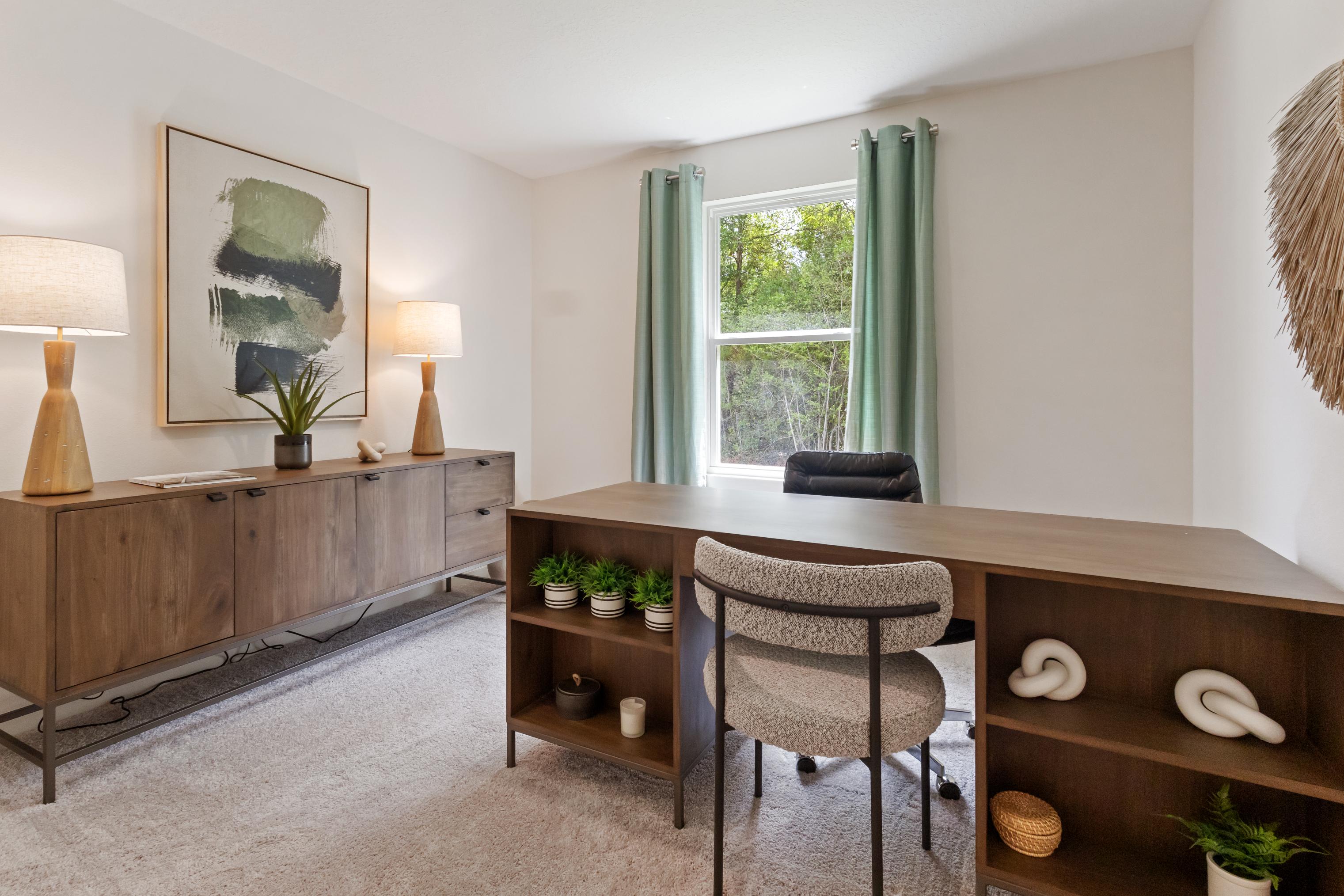 A room with a table and chairs.