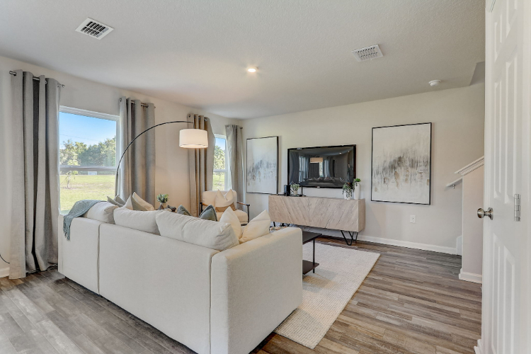 A living room with a large window.