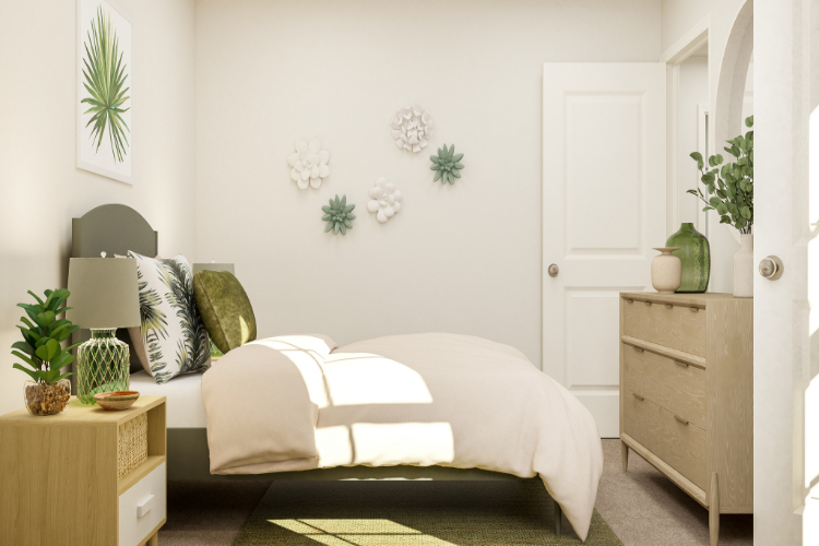 A room with a bed and a lamp.