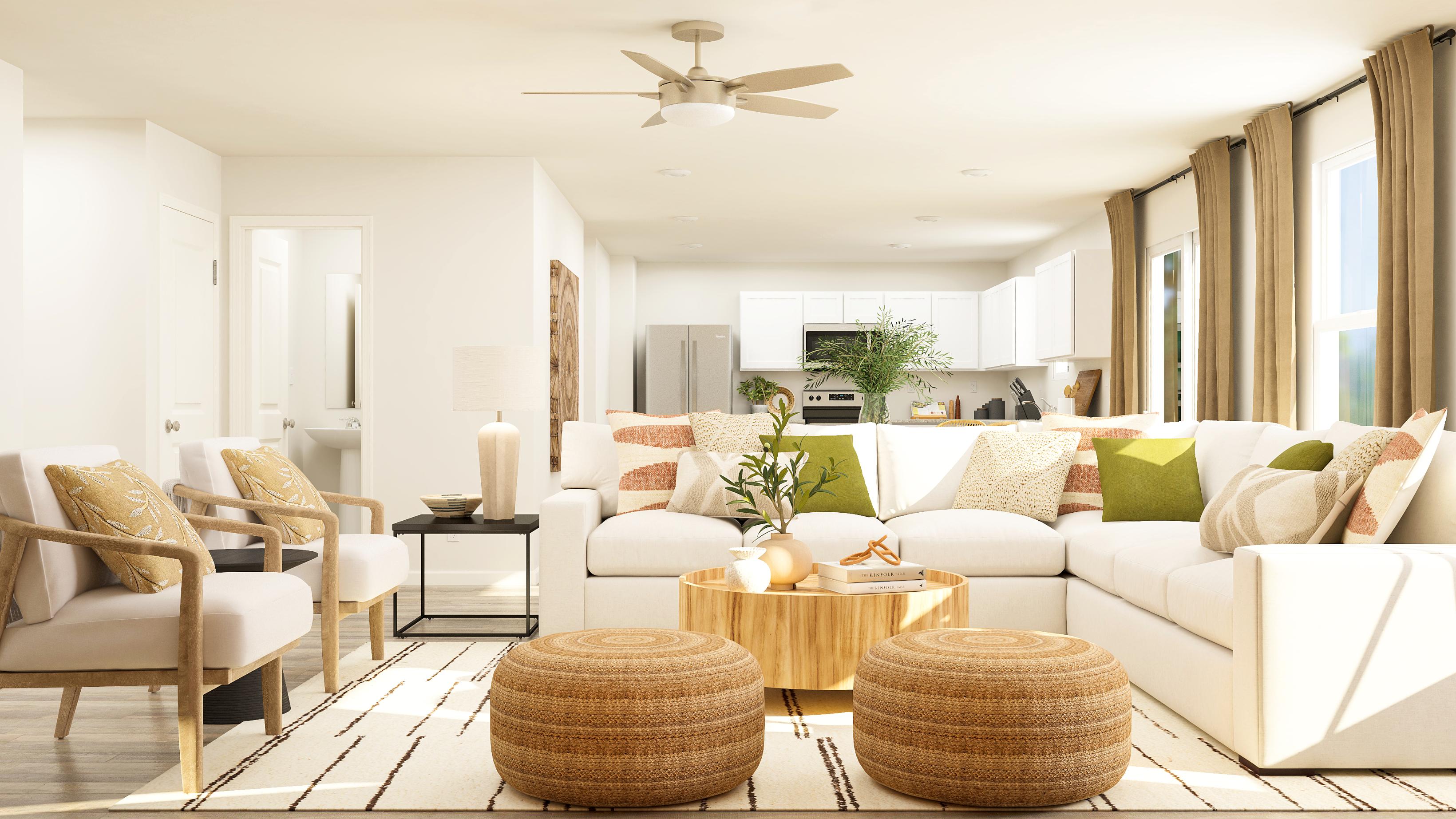 A living room with a white couch and a table.