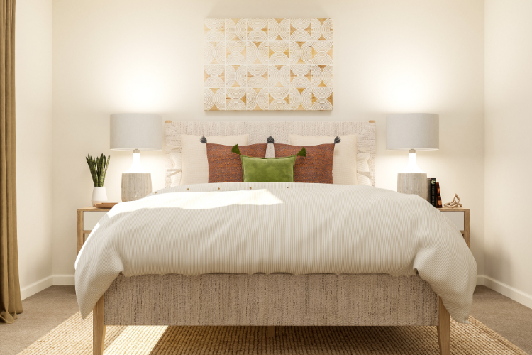 A bed with a white bed spread.